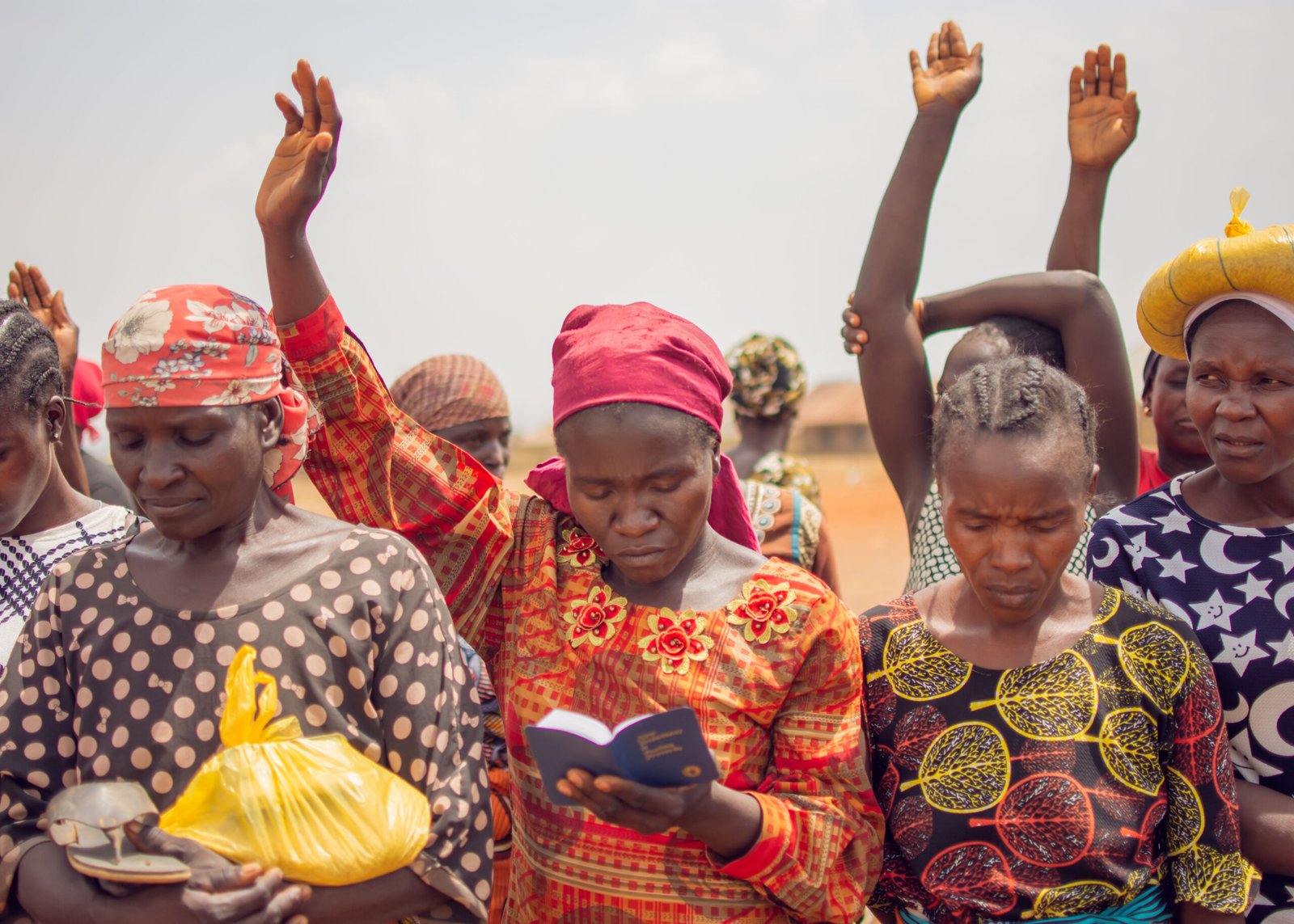 NIgerian women with hands raised