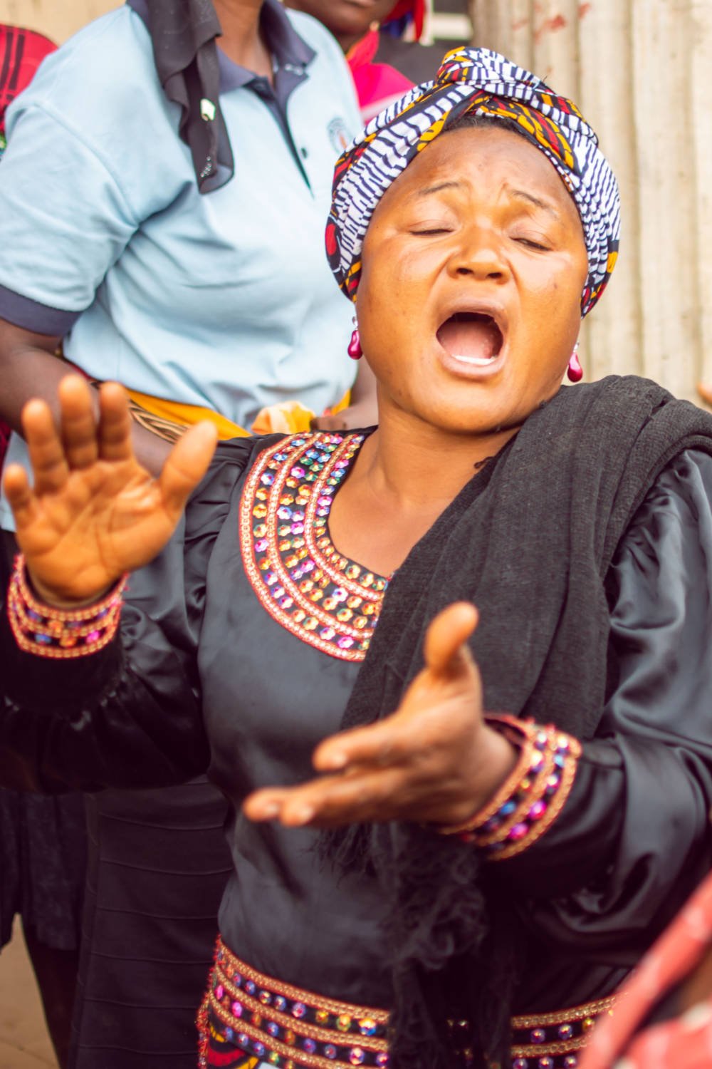 Woman singing at IDP camp.