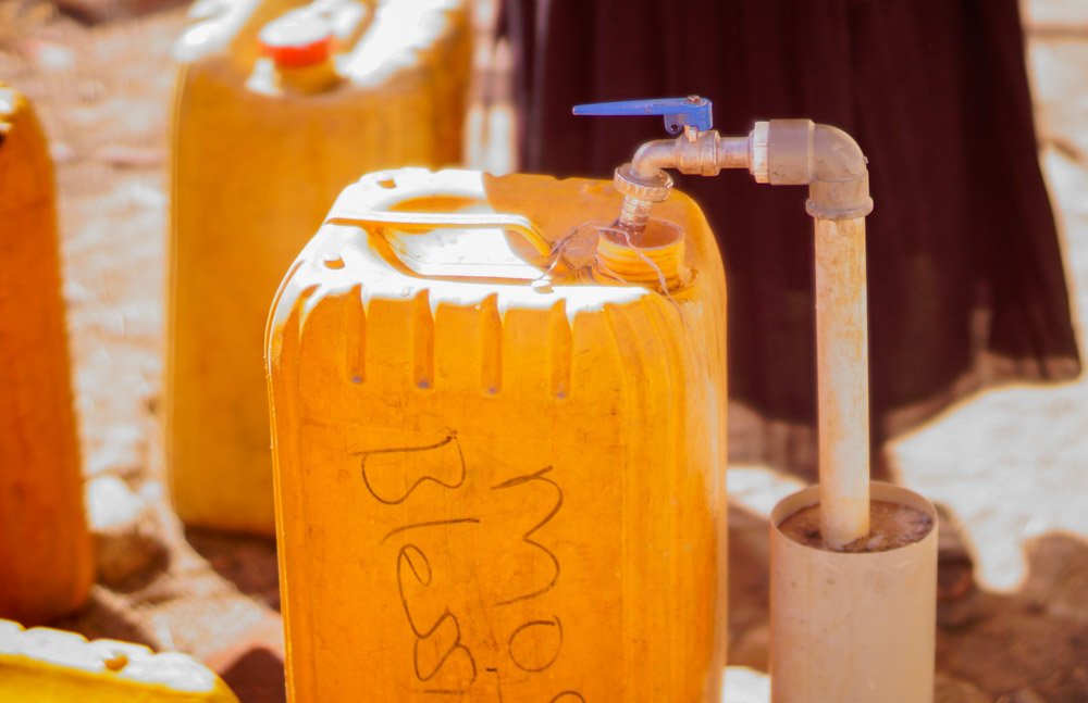 Jerry cans being filled